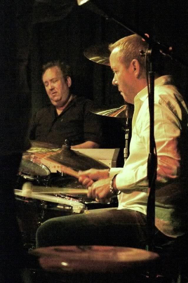 John Seppala playing drums on stage