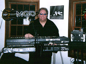 John Seppala at the keyboard, same gig as the MGD sign photo, a different moment