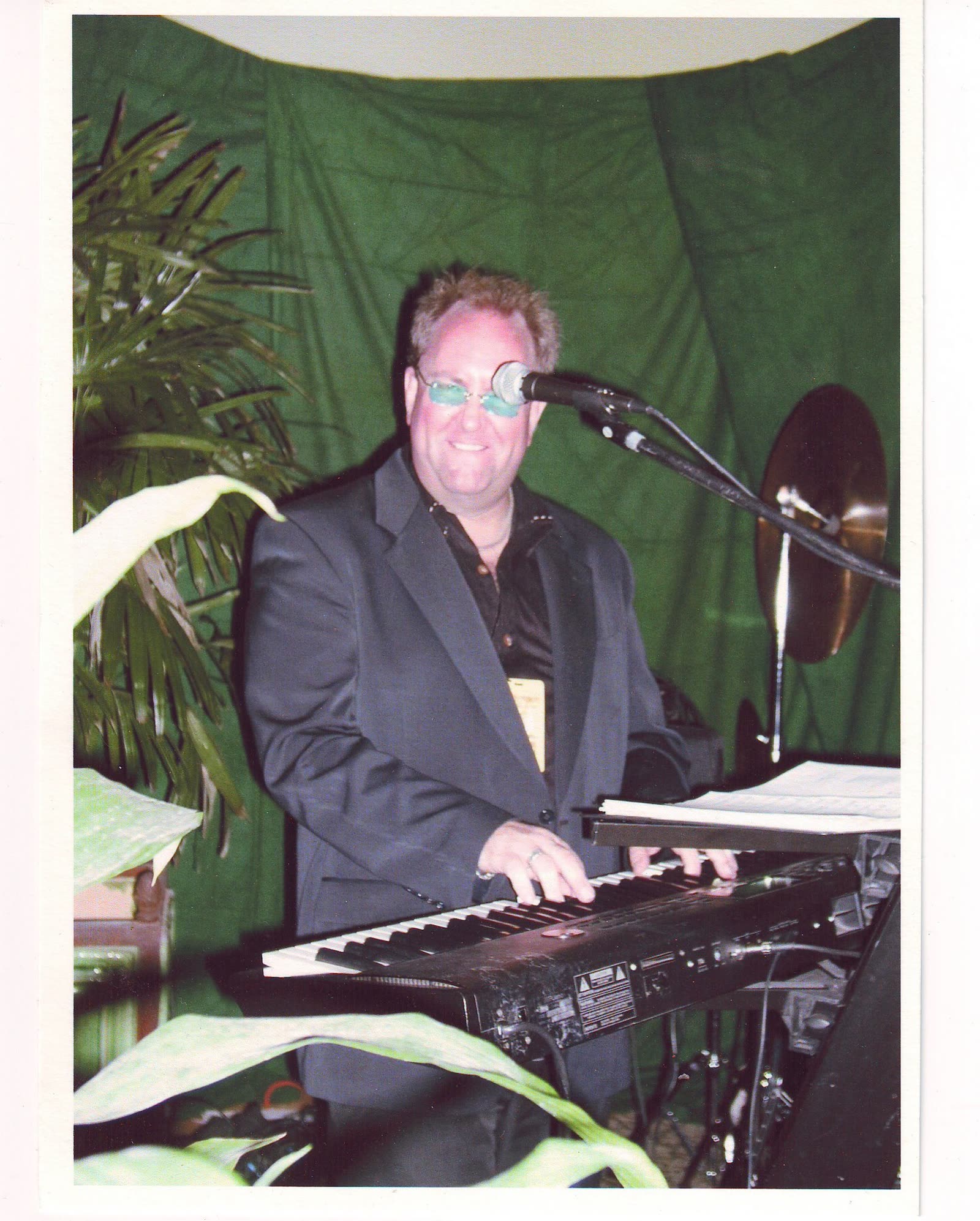 John Seppala performing on keyboard, smiling
