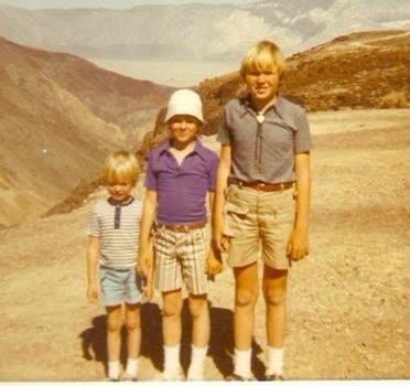John as a child hiking with his brothers